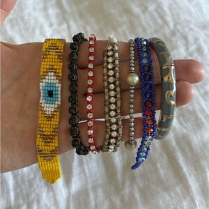 Eclectic collection of beaded and rhinestone bracelets